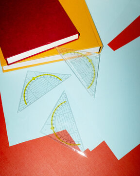 Set square rulers on business office desk and hard direct flashlight