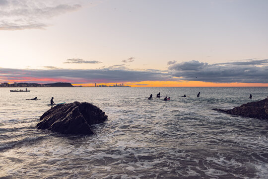 Surfers at Currumbin beach, Gold Coast