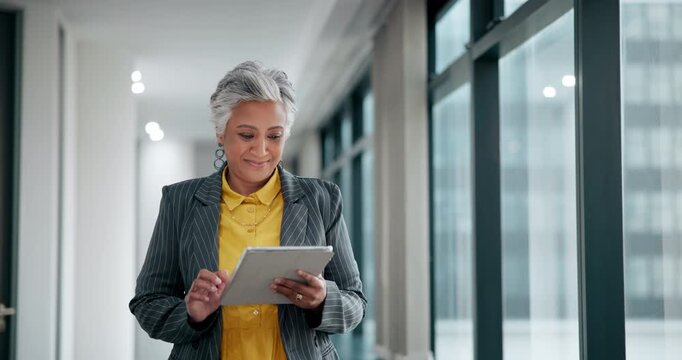 Business woman, mature and scroll with tablet in project management, administration and progress report. Female person, technology and walking for update, research and schedule at office or company