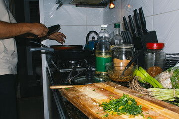 messy kitchen while cooking a dish