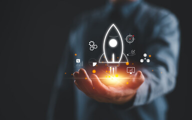 Businessman holding icons about business and investment, Rocketing take off with a targeted launch...
