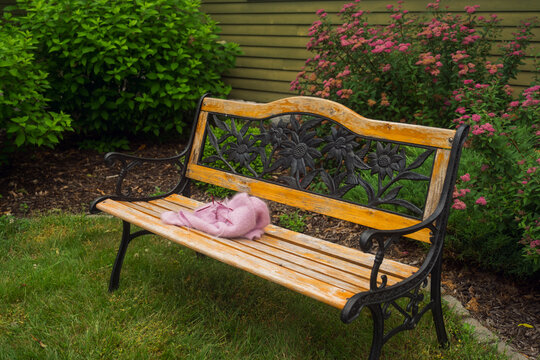 woman sitting in garden and knitting
