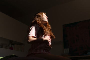 Woman Practicing Breathing Exercises in the Morning