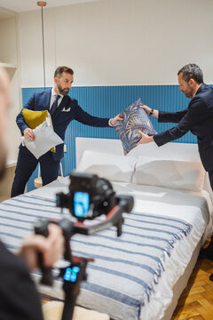 Real estate agents decorating bedroom