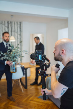 Videographer recording real estate agents