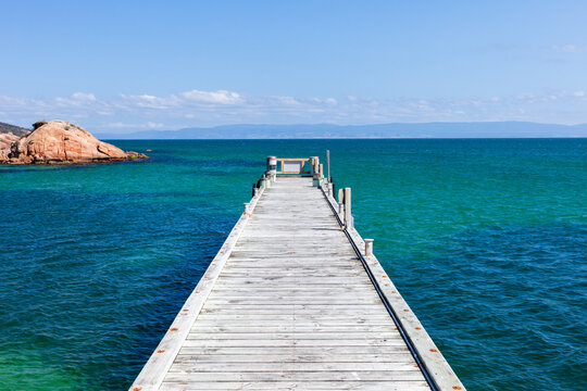 Boat dock lading to horizon on clear day