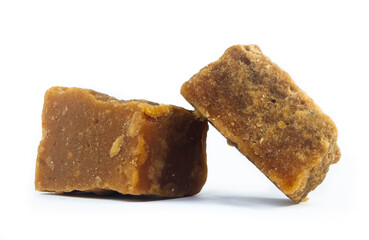 pieces of artisanal sugar cane panela on an isolated white background