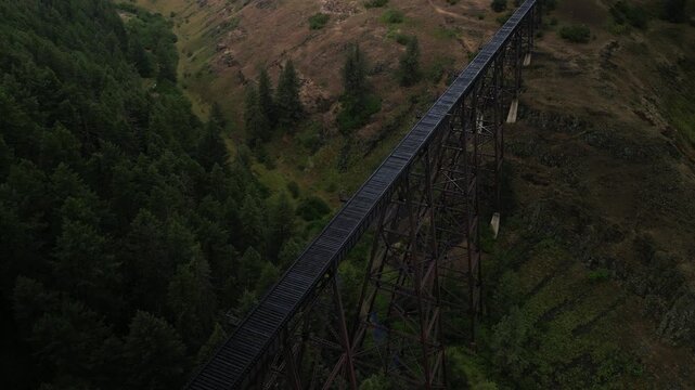 Aerial tilt down on Camas Prairie Railroad historic train trestle in Grangeville Idaho