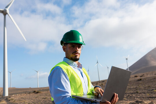 Energy professional using a laptop computer during a day's work