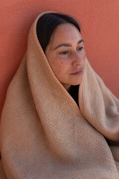 woman wrapped in blanket