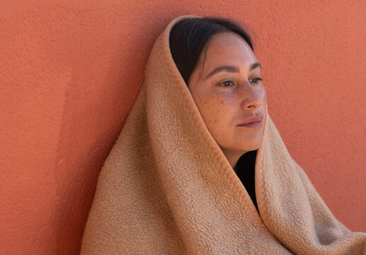woman wrapped in blanket