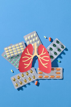 Lung Health Concept with Medication and Pills on Blue Background