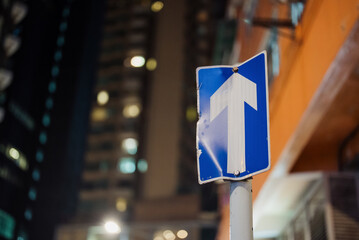 Upward Arrow Traffic Sign at Night