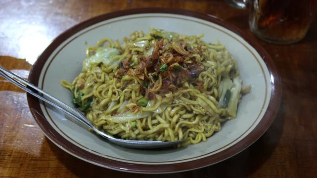 Mie Goreng Jawa or bakmi jawa or java noodle. Indonesian traditional street food noodles from Central Java or Yogyakarta.