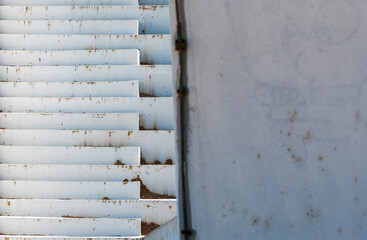 Dirty White Wall Around the Corner: Concrete Staircase Perspective.