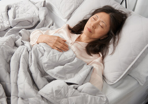 Restful Tranquility:Asian Woman Sleeping - Powered by Adobe
