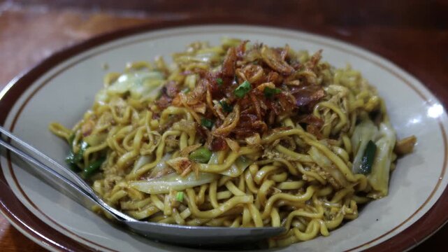 Mie Goreng Jawa or bakmi jawa or java noodle. Indonesian traditional street food noodles from Central Java or Yogyakarta.