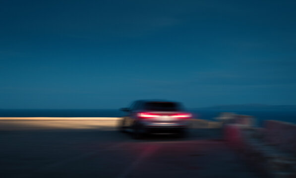 Fototapeta Blurred car in movement at sunset