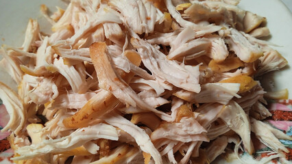 close up of shredded chicken meat