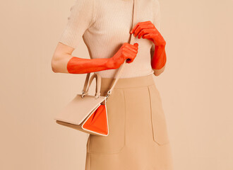 Fashionable Woman Holding Stylish Handbag With Painted Red Hands