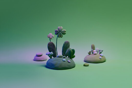Clay art scene with miniature plants, featuring four-leaf
