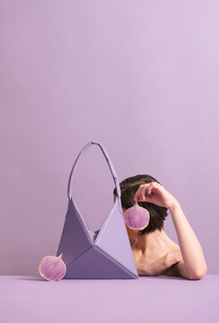 Elegant Lilac Handbag and Woman Holding Petal