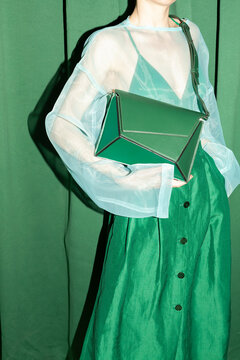 Green Fashion Outfit with Stylish Geometric Handbag
