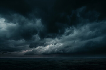 Obraz premium Dramatic Dark Stormy Sky Over Ocean with Heavy Clouds and Distant Lightning