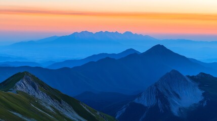 A panoramic view of a majestic mountain range during sunset with layers of colors in the sky and a serene valley below capturing the aweinspiring beauty of the natural landscape