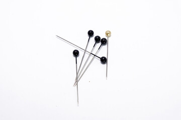 pins on a white background