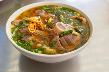 Bowl of traditional and famous Vietnamese noodle dish - Bun Bo Hue