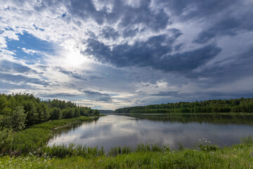 A cloudy day with a river in the background