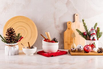 Eco-friendly countertop, decorated for the New Year and Christmas with kitchen utensils made of natural materials. Front view. Waste-free kitchen.