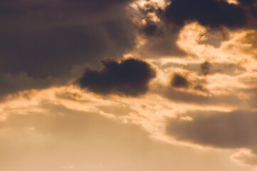 dramatic dusk. heavy clouds on the sky in golden light above the horizon. summer holidays rainy weather forecast