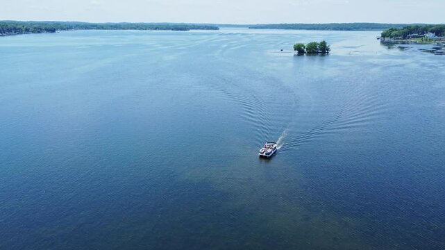 Beautiful Lake Pewaukee In Waukesha County, Wisconsin. 4K Aerial Parallax Over A Moving Boat.