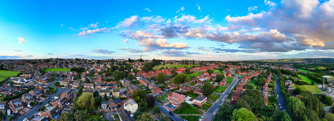 Panorama aerial drone photography of a summer evening in a typical urban town scene in the town of...