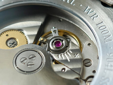 A close-up image of the mechanism of an automatic wristwatch.