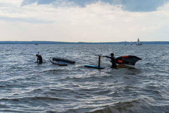Wingfoil rider riding in the lake.