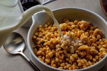 Milk and granola.
Breakfast image.
