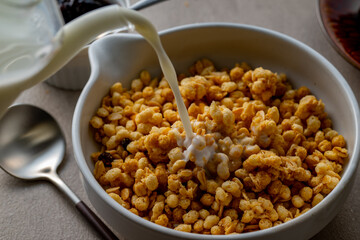 Milk and granola.
Breakfast image.

