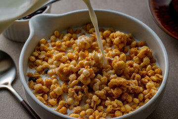 Milk and granola.
Breakfast image.
