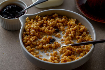 Milk and granola.
Breakfast image.
