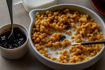 Milk and granola.
Breakfast image.
