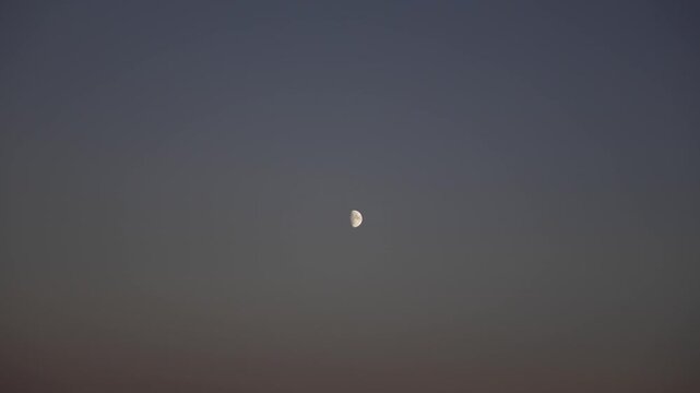Half quarter moon celestial object still stable shot, empty clear sky, astrology