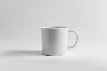 Obraz premium A Plain White Ceramic Mug on a White Surface