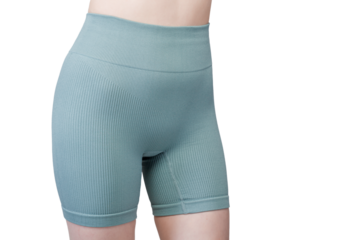 Sports jacket of green color, women's sports suit seamless, jacket for yoga training on a girl on an isolated white background close-up