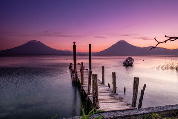Traditional moorings and volcanoes of Atitlan 3537 m. and San Pedro 3020 m. Lake Atitlan, Sololá...
