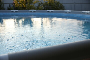 Above ground swimming pool in garden, closeup