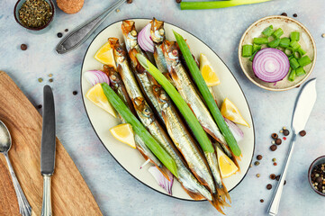 Smoked capelin fish with lemon