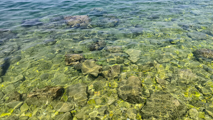 Adriatic sea surface with pebbles and stones 